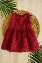 Burgundy Dress on Woven Mat.webp